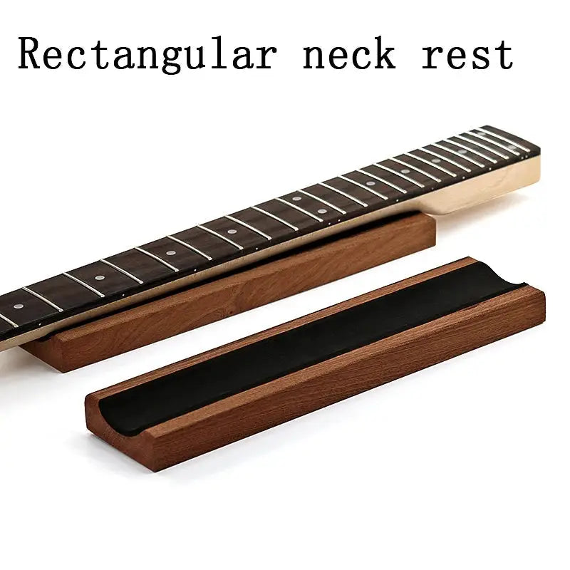 Guitar and Bass Neck Rest made of sapele wood with cork lining, designed for fretwork and maintenance, shown supporting a guitar neck.