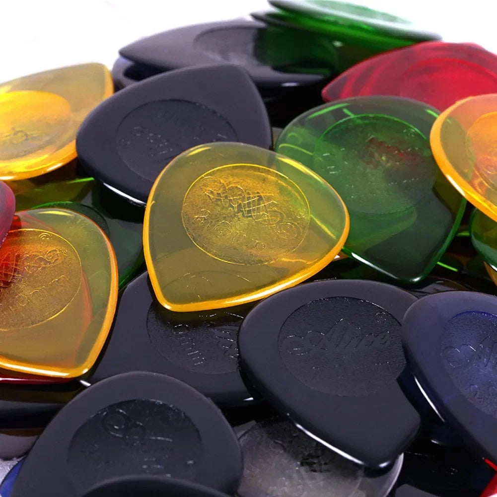 50Pcs Alice Stubby Guitar Picks in assorted colors, featuring a durable design for enhanced grip and precision. Ideal for electric and jazz guitarists.